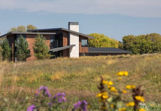 modern home on hill in a prairie