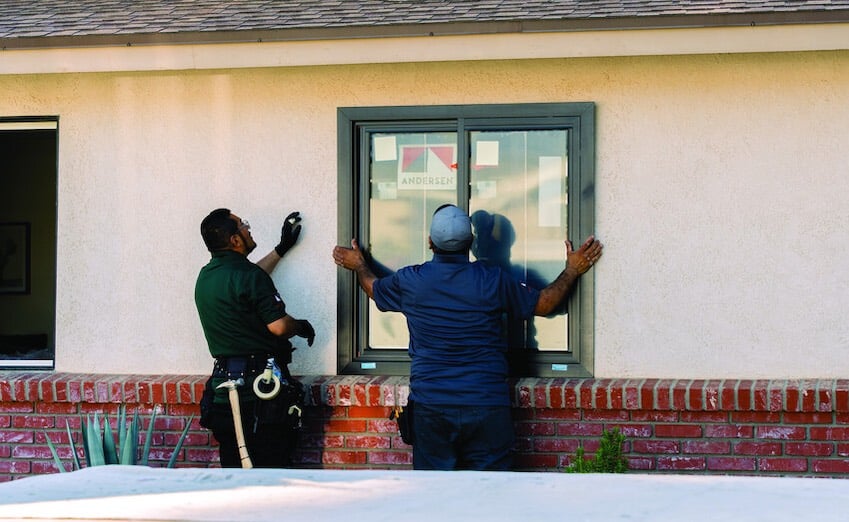 Andersen Certified Contractors installing window
