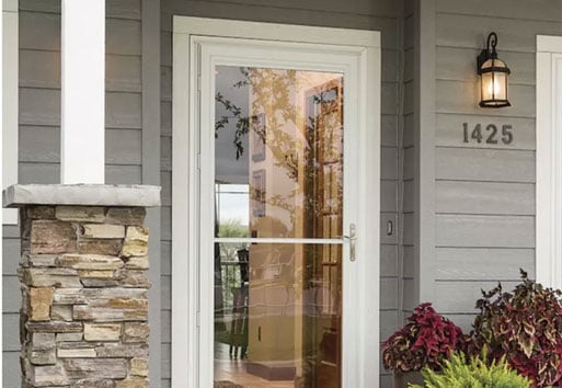 exterior view of house with Andersen white storm door