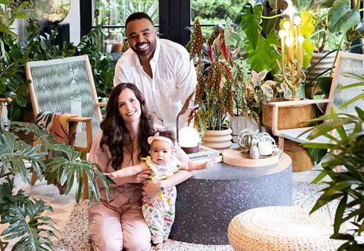 family sitting on on floor in sunroom